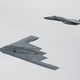 A B-2 Spirit bomber flying alongside a F-15C Eagle, 2017.